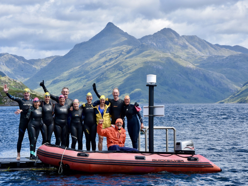 Swimmers and escort boat
